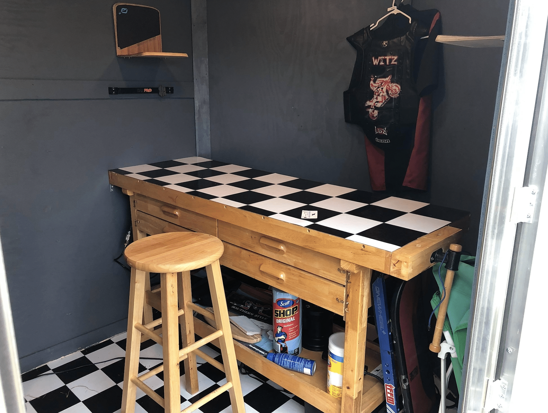Workbench, tools and stored tires inside the Witz Wheel service trailer.